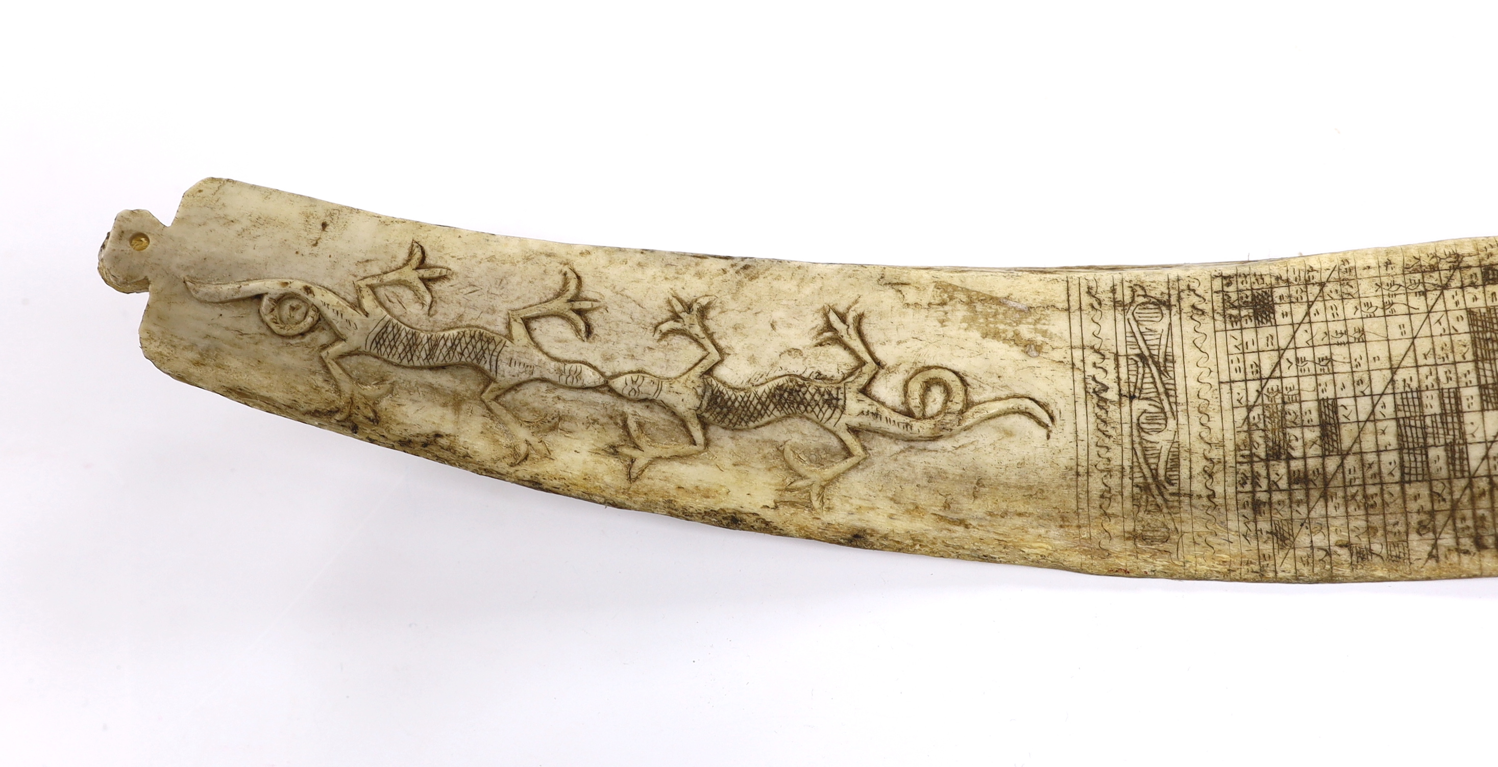 A late 19th/early 20th century Indonesian, Sumatran, carved buffalo rib calendar, Batak, 37cm